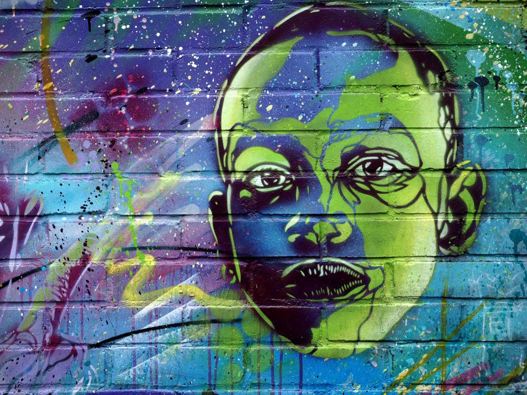 Jungengesicht von C215 in blau und grün