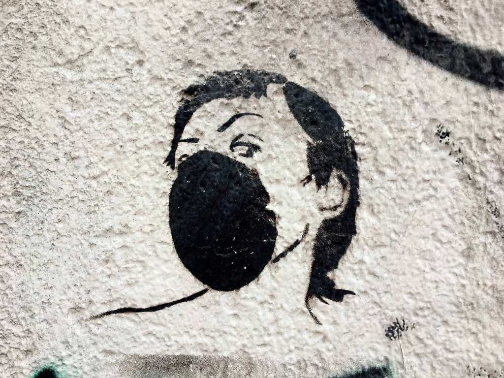 Stencil von einer Frau mit Atemmaske